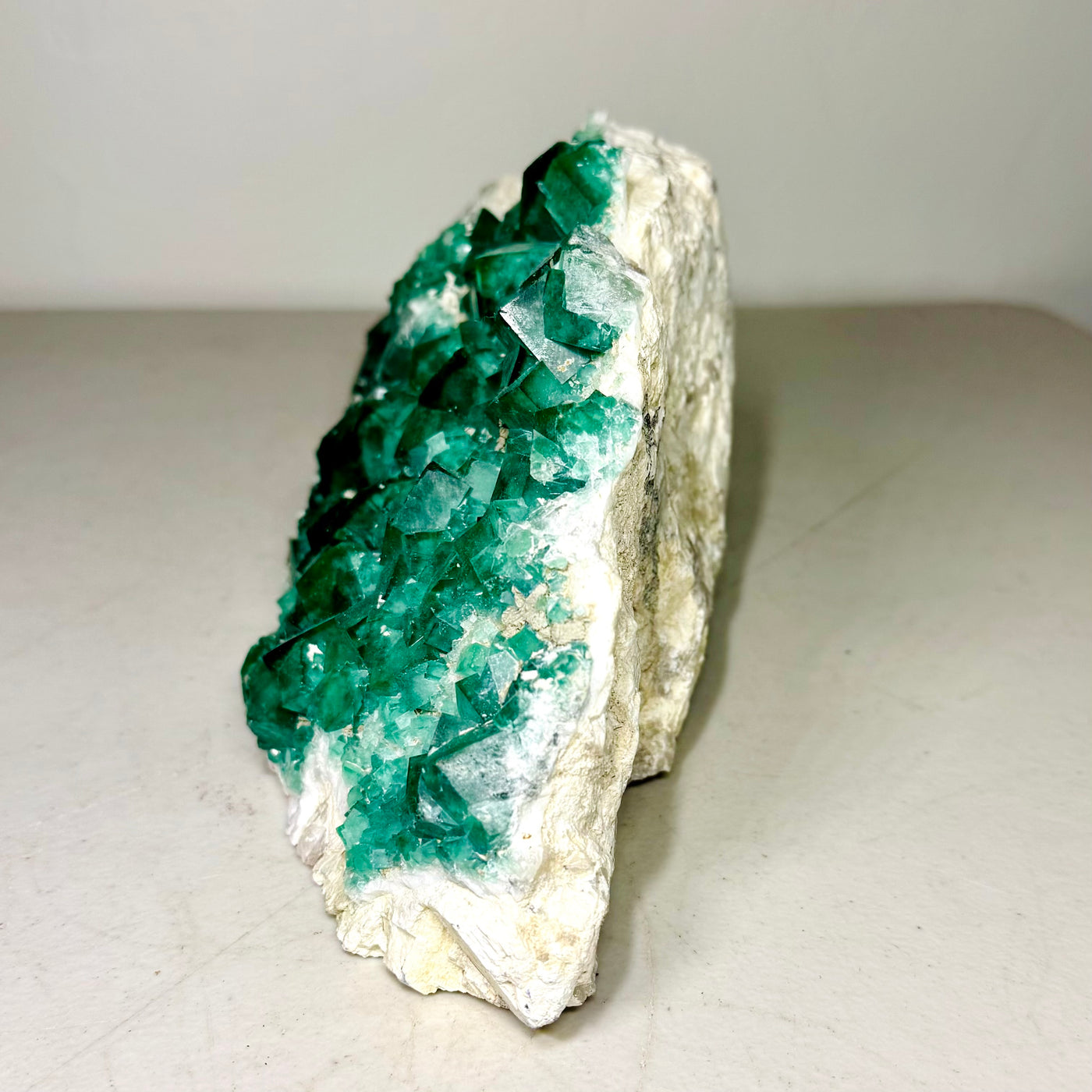 Side profile of the green fluorite cluster on matrix