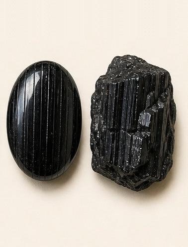 Black Tourmaline shown as a polished palm-stone or cabochon form beside a rough form in a generated educational comparison illustration