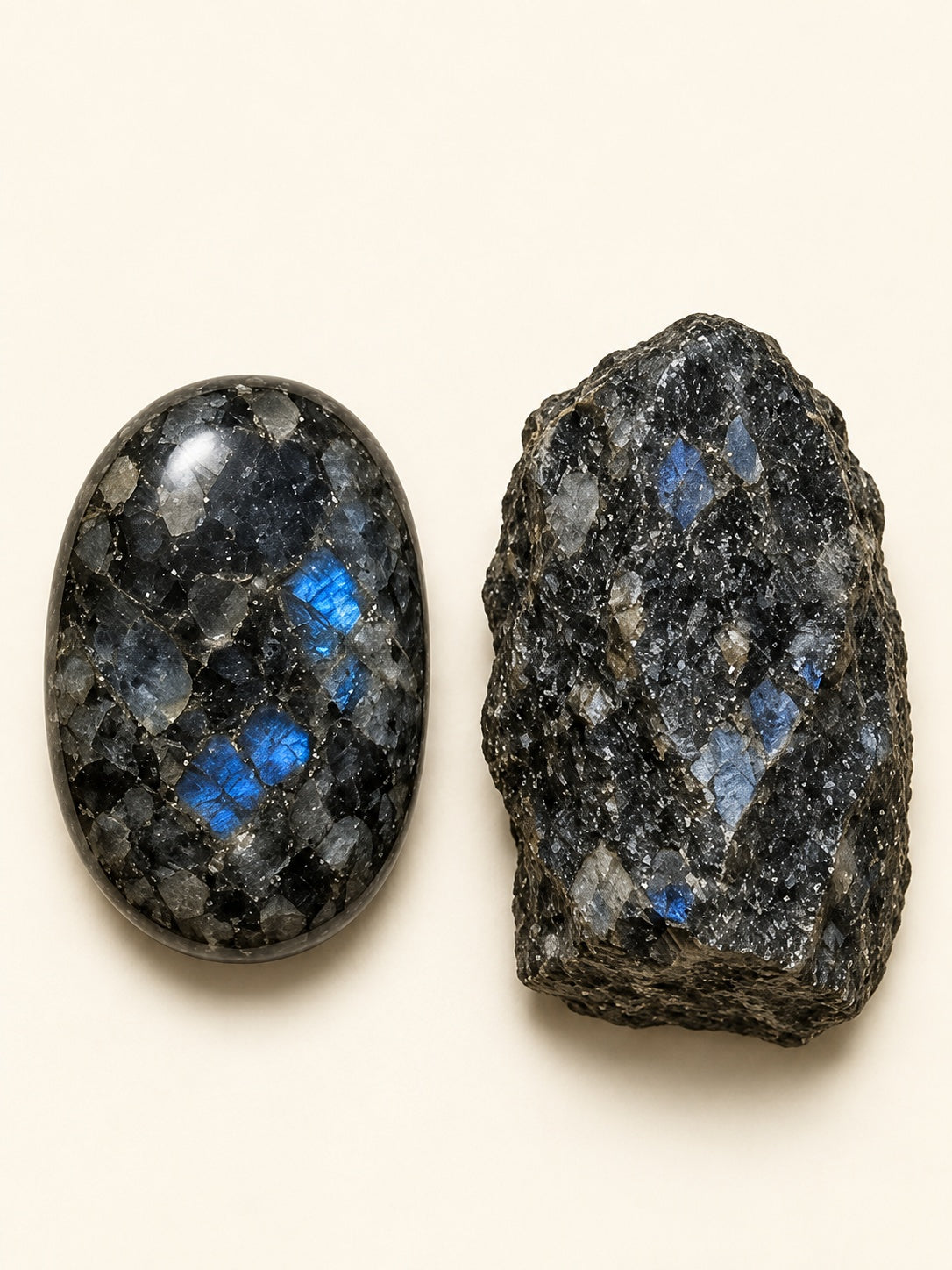 Larvikite shown as a polished palm-stone or cabochon form beside a rough form in a generated educational comparison illustration