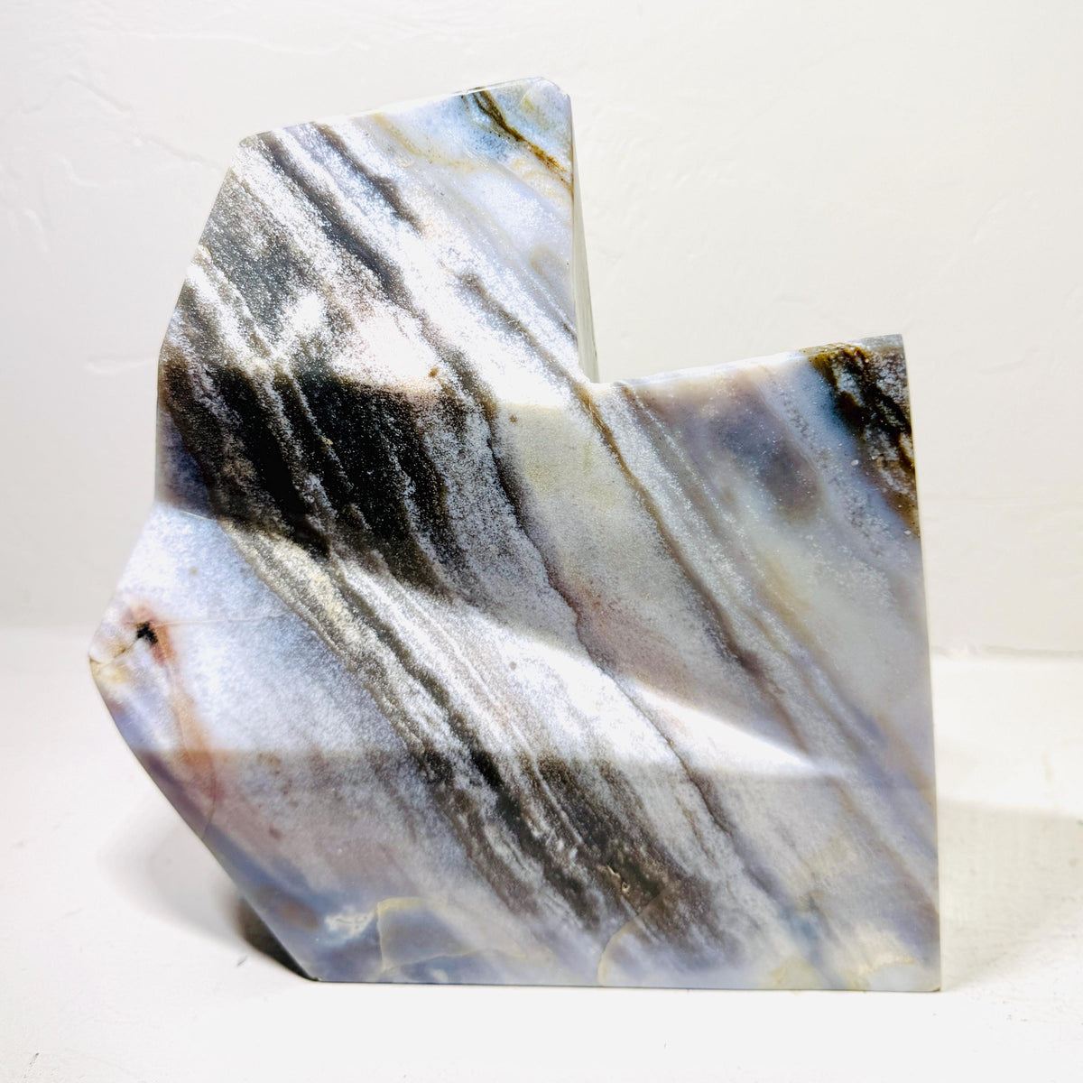 Reverse of Silver Leaf Jasper AE105 showing diagonal charcoal and cream bands