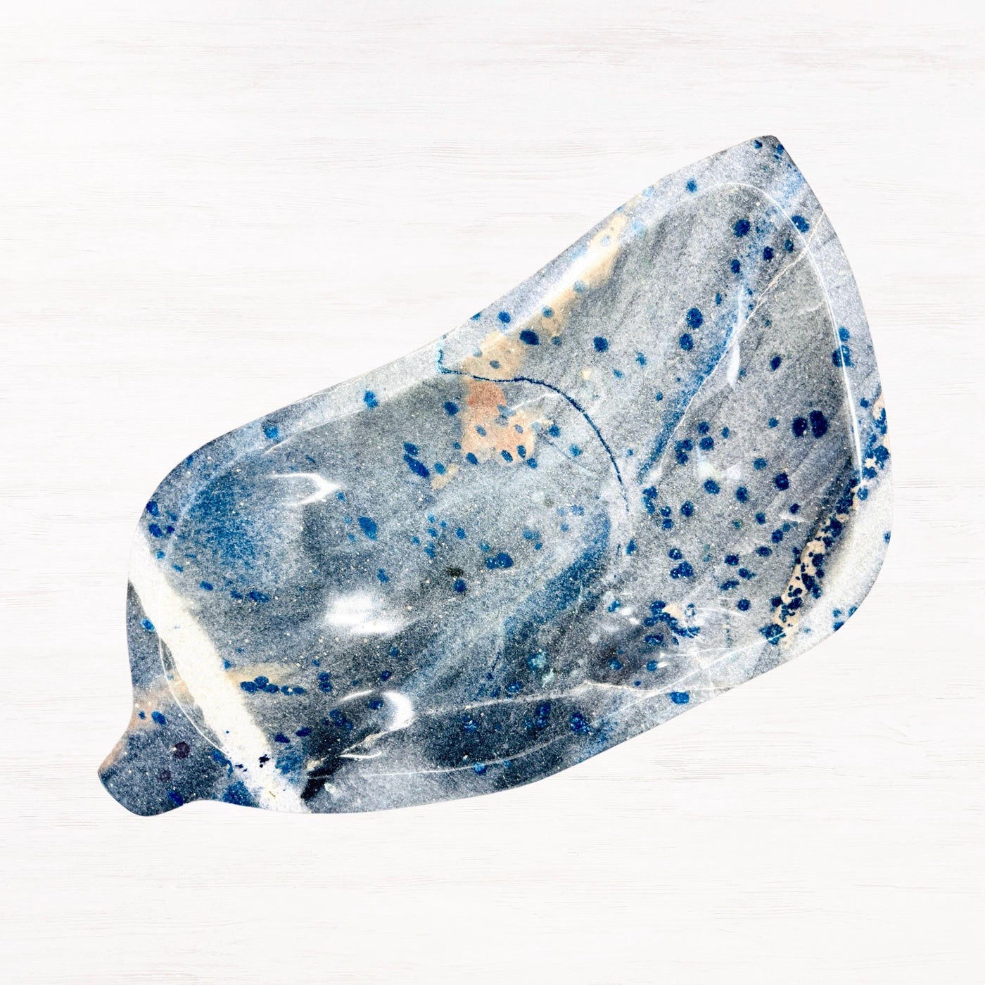 Angled view into leaf bowl AE110 showing organic contours and a natural stripe through the stone