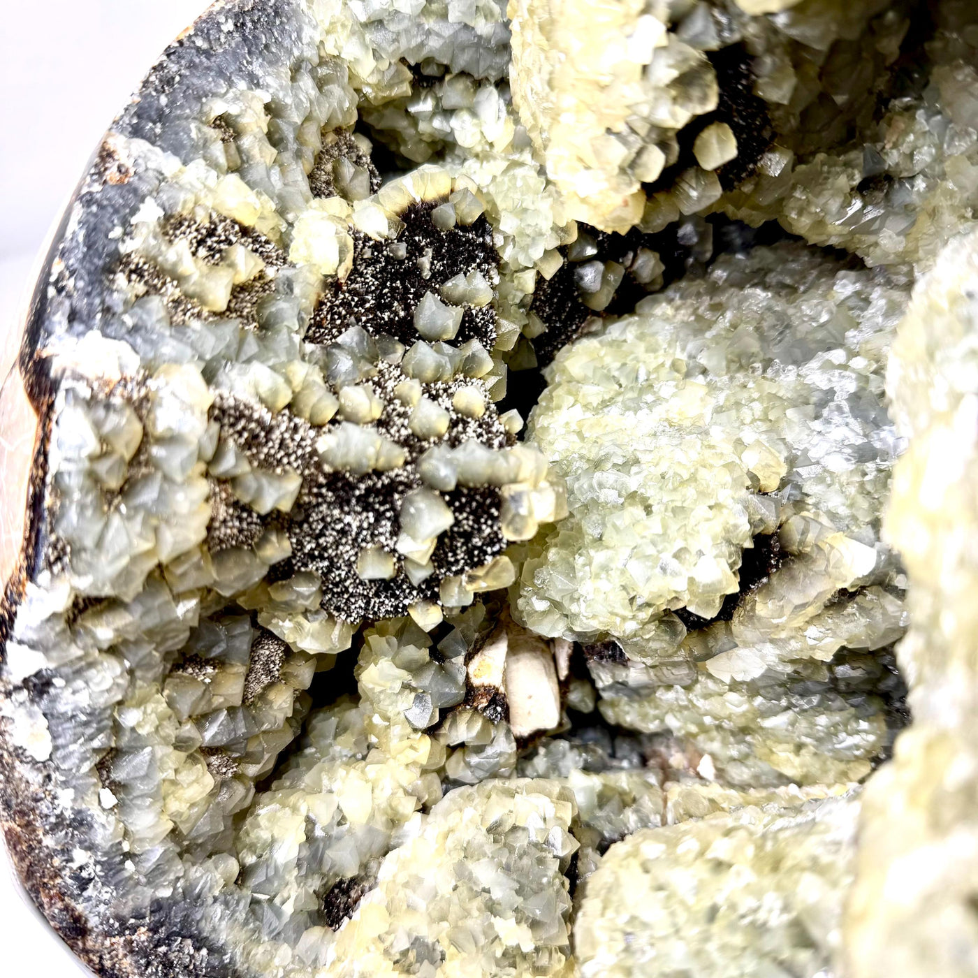 Macro view of golden and cream crystal formations inside Septarian geode AET29