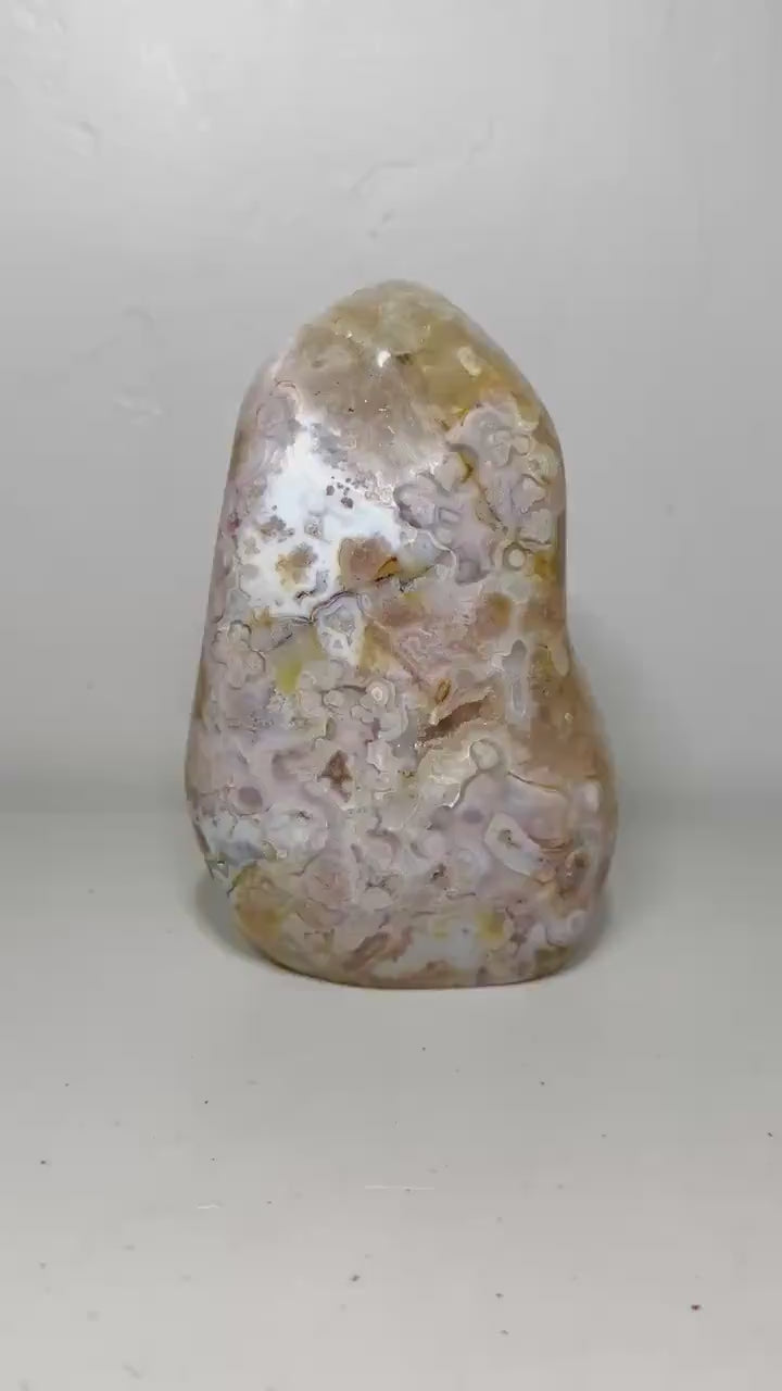 Video of one-of-a-kind pink amethyst freeform ML-164 rotating to show its cream, gold and lavender patterning